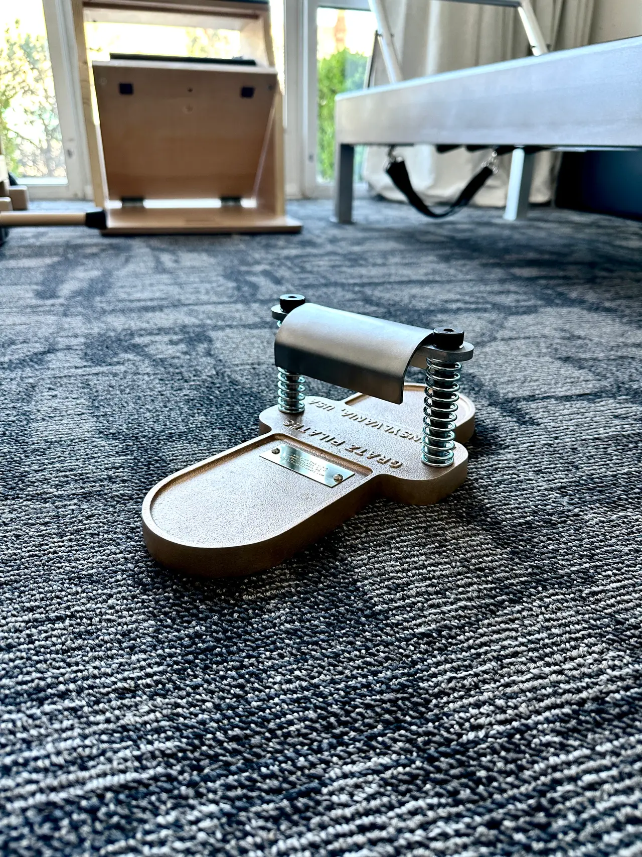 Close-up of a Gratz foot corrector, classical Pilates equipment used to build foot and arch strength