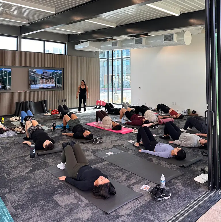 Group mat Pilates class at a community event in Las Vegas